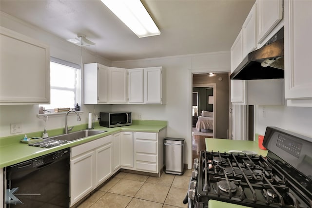 kitchen featuring sink, white cabinets, light tile patterned flooring, black appliances, and crown molding