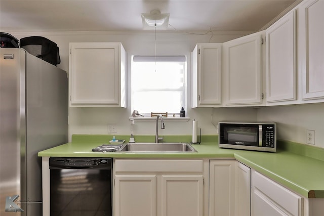 kitchen with a sink, appliances with stainless steel finishes, white cabinets, and light countertops