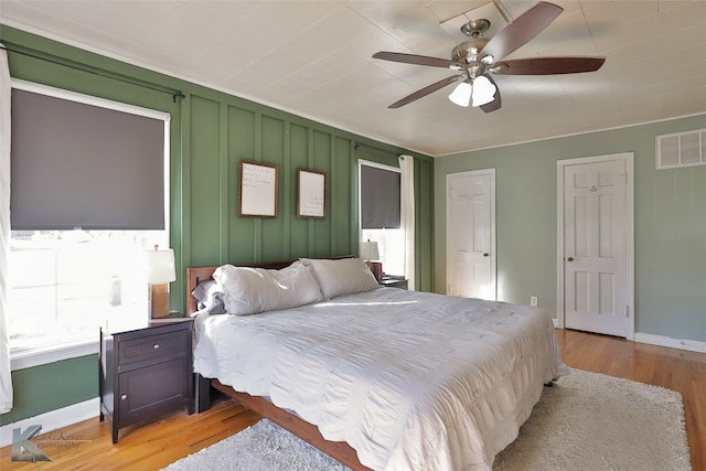 bedroom featuring light wood-type flooring and ceiling fan