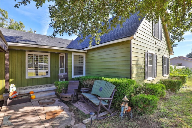 back of house with a patio