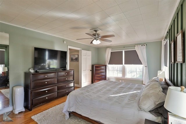 bedroom featuring ceiling fan and light hardwood / wood-style flooring