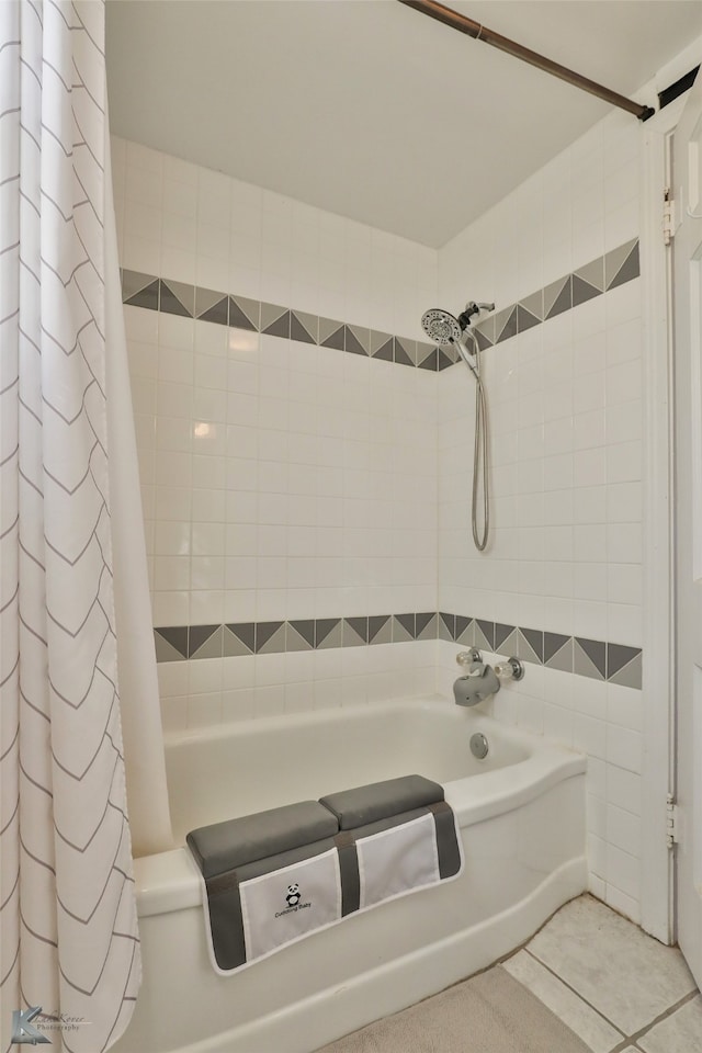 bathroom featuring tile patterned flooring and shower / bath combination with curtain