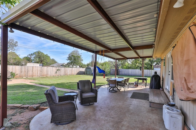 view of patio / terrace with a storage shed