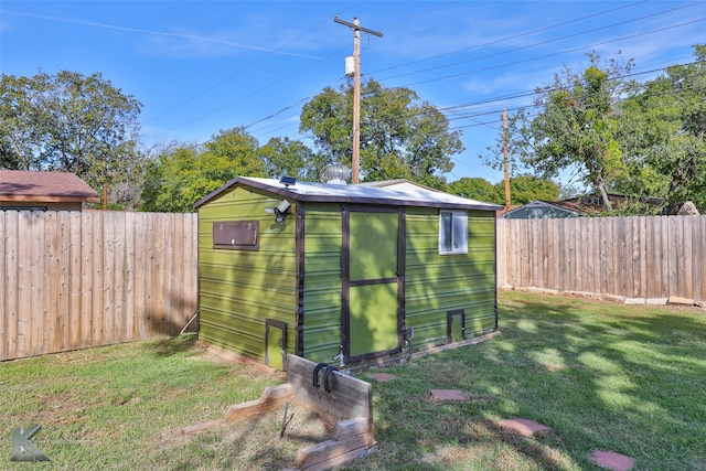 view of outbuilding featuring a yard