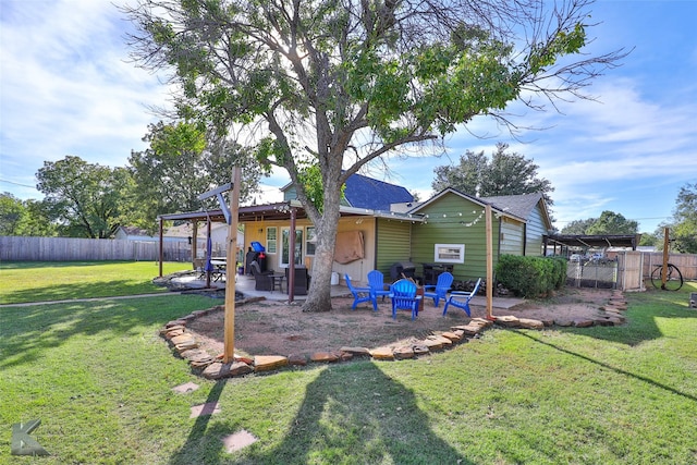 back of house with a patio area, fence, and a lawn