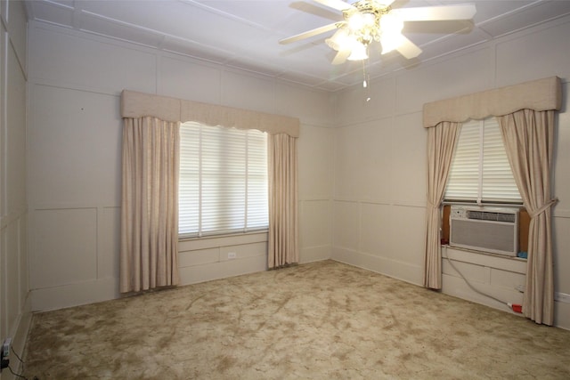 231 N 3rd Ave, Munday, TX 76371 - carpeted spare room featuring a decorative wall, ceiling fan, and cooling unit