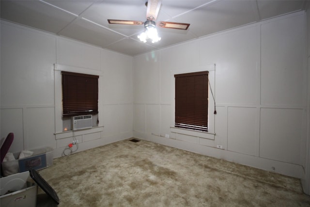 231 N 3rd Ave, Munday, TX 76371 - carpeted spare room featuring a decorative wall and a ceiling fan