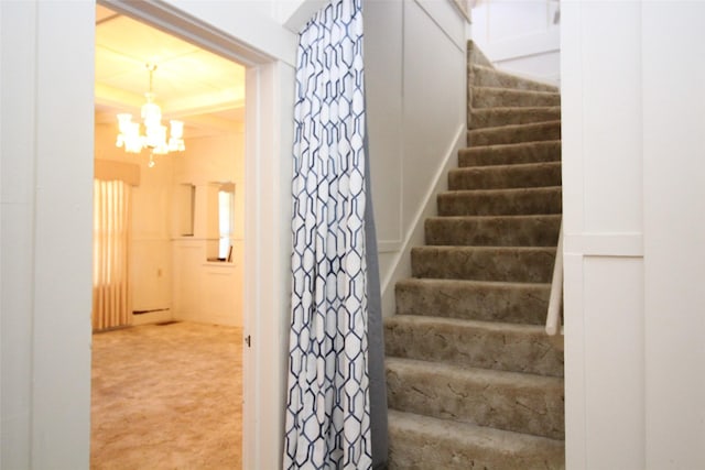 231 N 3rd Ave, Munday, TX 76371 - stairs with a chandelier and carpet flooring