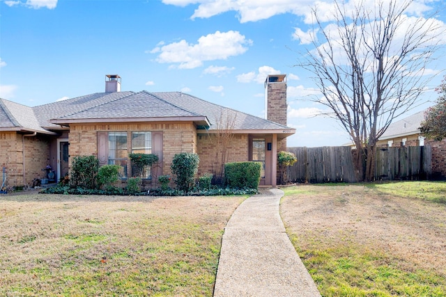 ranch-style home featuring a front yard