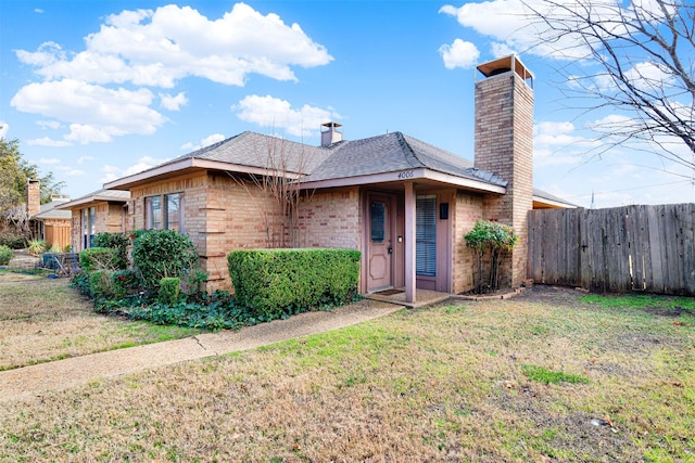 ranch-style house with a front lawn