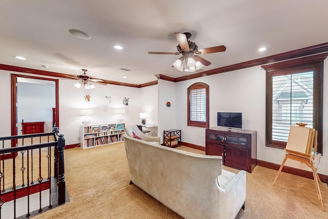 living room featuring ceiling fan, carpet floors, and ornamental molding