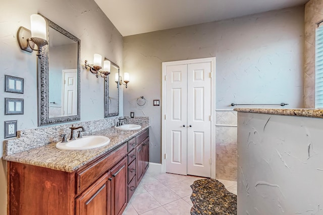 bathroom with tile patterned floors and vanity