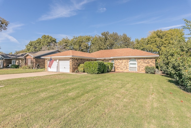 ranch-style house with a garage and a front lawn