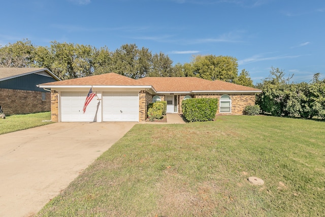 single story home featuring a front lawn and a garage