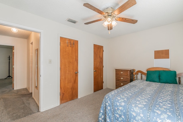 bedroom with ceiling fan and carpet