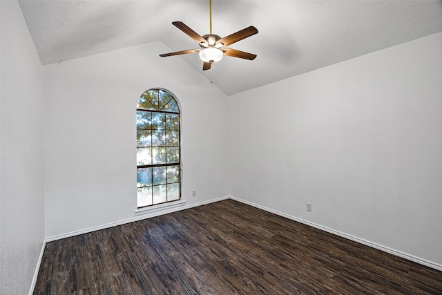 4007 Frisco Ct, Granbury, TX 76048 - spare room with ceiling fan, dark wood-type flooring, vaulted ceiling, baseboards, and a textured ceiling