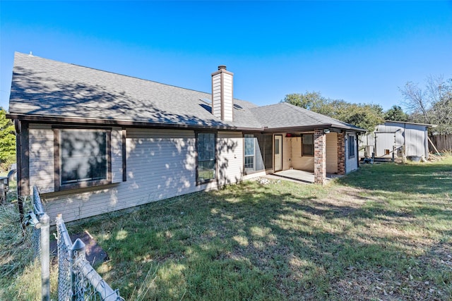 4007 Frisco Ct, Granbury, TX 76048 - back of property with a chimney and a patio