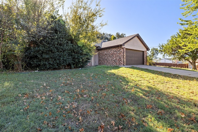 exterior space with a lawn and a garage