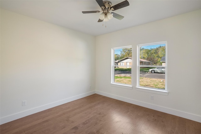 spare room featuring ceiling fan and wood-type flooring