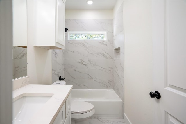 full bathroom with vanity, toilet, and tiled shower / bath