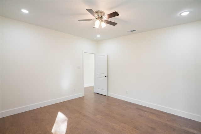 spare room featuring hardwood / wood-style flooring and ceiling fan