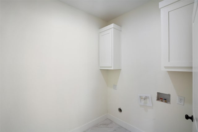 clothes washing area featuring electric dryer hookup, cabinets, and hookup for a washing machine