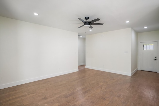 unfurnished room with hardwood / wood-style floors and ceiling fan