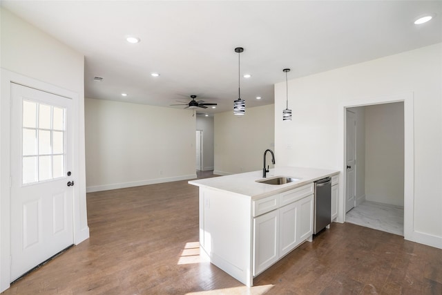 kitchen with white cabinetry, sink, ceiling fan, stainless steel dishwasher, and pendant lighting