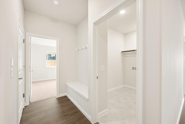 mudroom featuring wood finished floors and baseboards