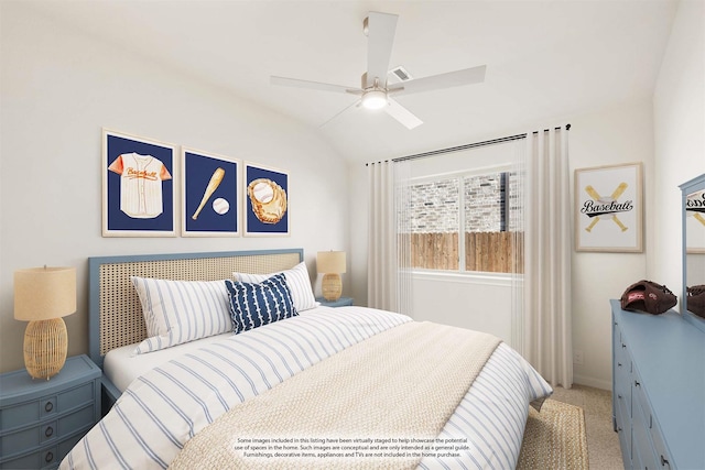 bedroom with a ceiling fan, light carpet, and vaulted ceiling