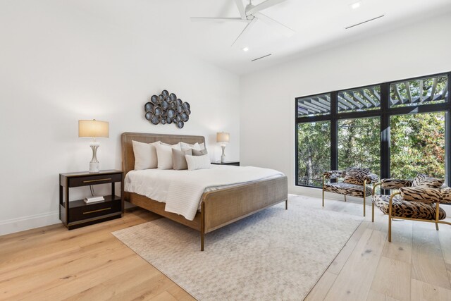 bedroom with hardwood / wood-style flooring and ceiling fan