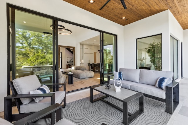 sunroom featuring a wealth of natural light and wood ceiling