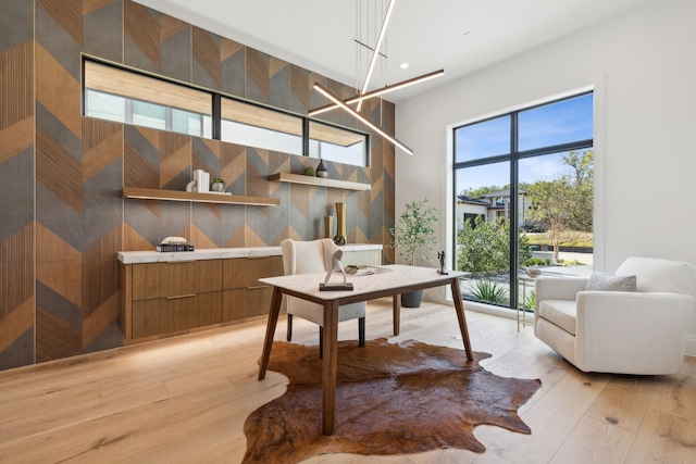 office with light wood-type flooring