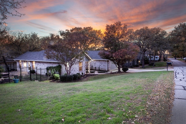 view of yard at dusk