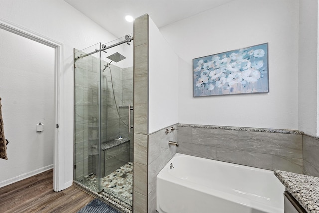 105 Lost Oaks Dr, Waco, TX 76705 - full bath with a garden tub, a stall shower, and wood finished floors