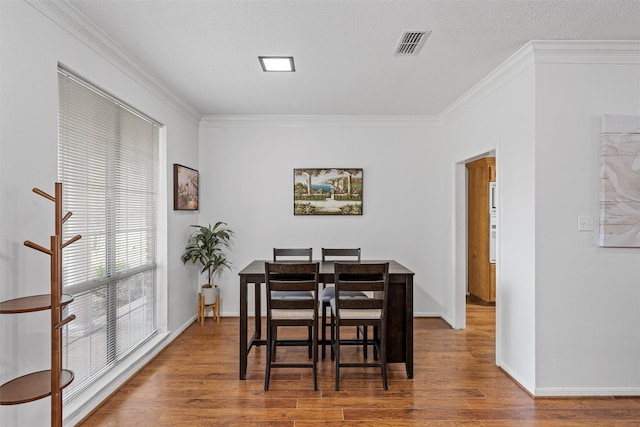 105 Lost Oaks Dr, Waco, TX 76705 - dining area with ornamental molding, wood finished floors, and baseboards