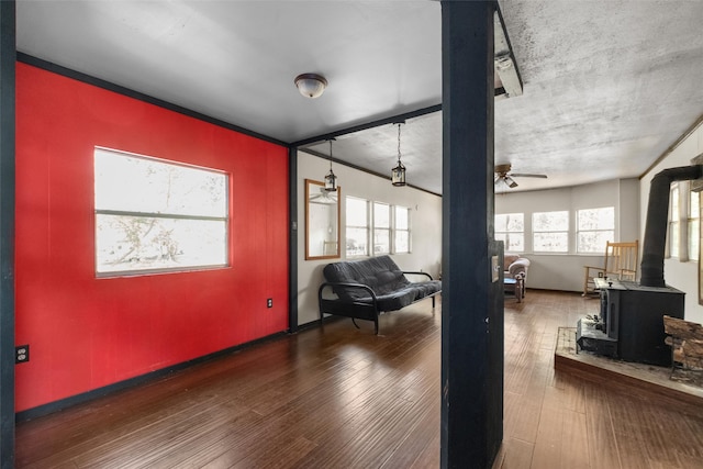 interior space featuring ceiling fan and dark wood-type flooring