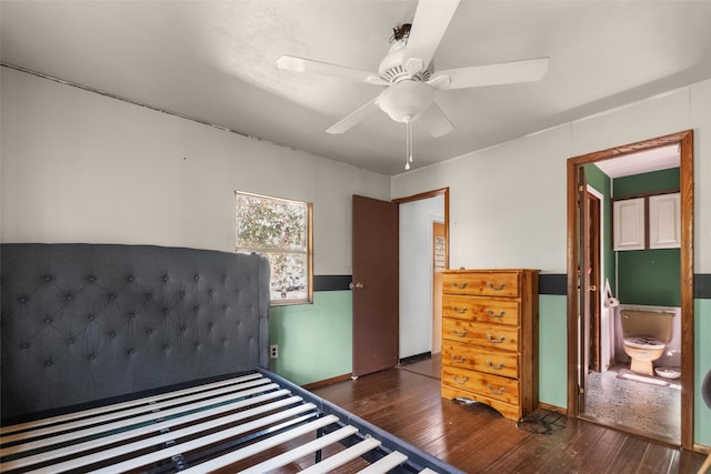 unfurnished bedroom featuring ceiling fan, ensuite bathroom, and dark hardwood / wood-style floors