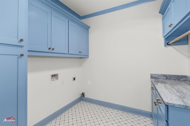 laundry area with hookup for an electric dryer, cabinets, and hookup for a washing machine