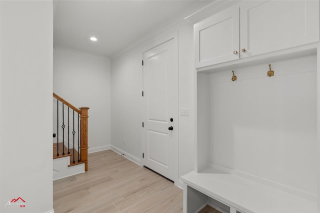 mudroom with light hardwood / wood-style flooring