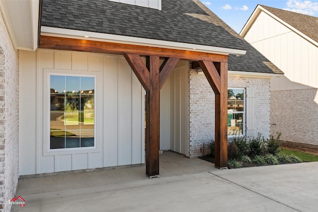 view of exterior entry featuring a patio