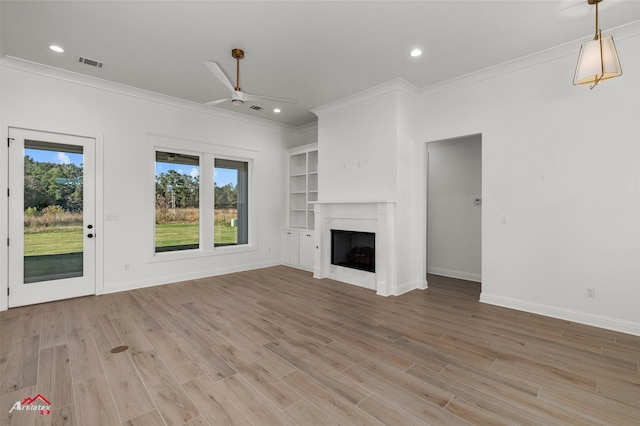 unfurnished living room with light hardwood / wood-style floors, ceiling fan, and ornamental molding