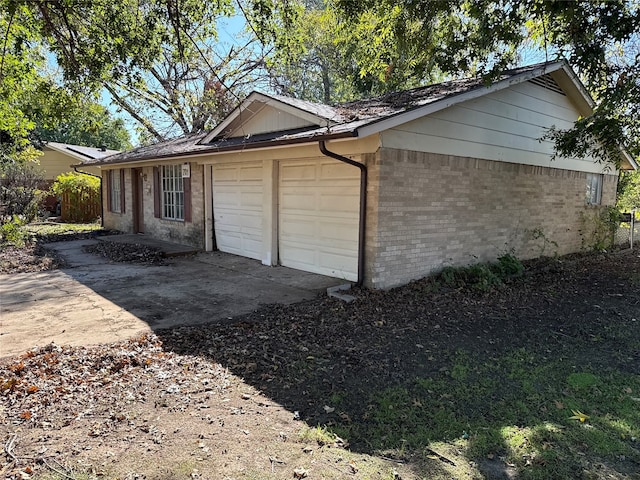 view of property exterior with a garage