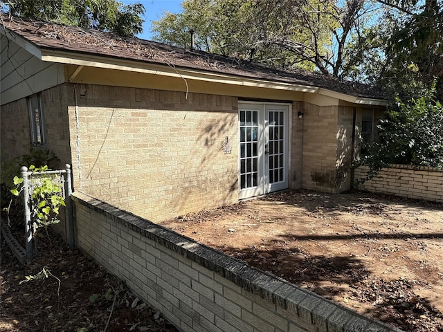 view of side of property featuring french doors