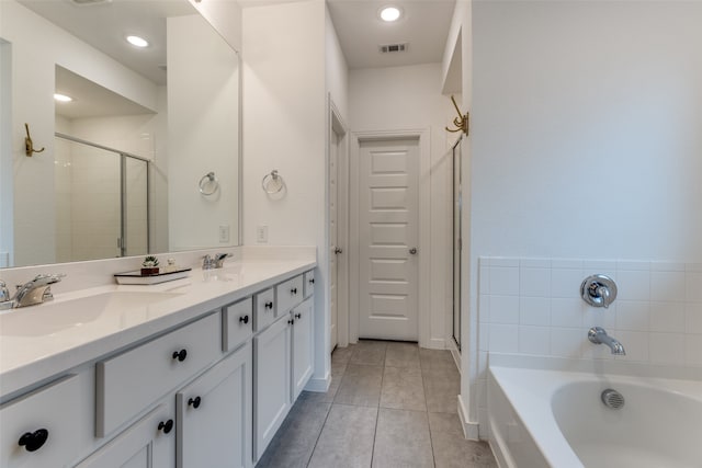 bathroom with tile patterned floors, plus walk in shower, and vanity