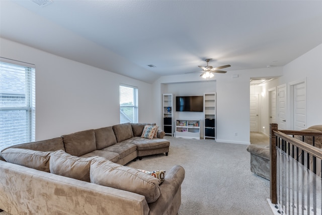 carpeted living room featuring ceiling fan