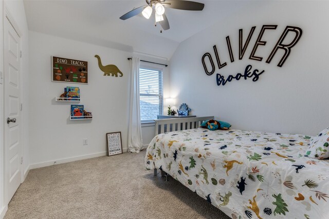 carpeted bedroom featuring ceiling fan and lofted ceiling