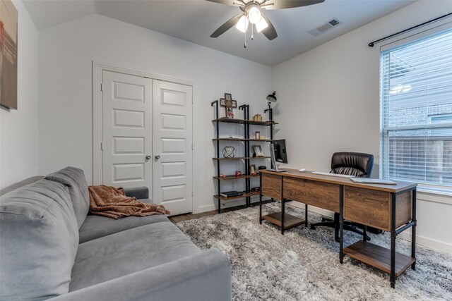 office with hardwood / wood-style floors, ceiling fan, and lofted ceiling