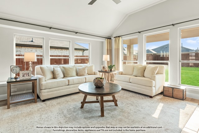 sunroom / solarium featuring ceiling fan and lofted ceiling