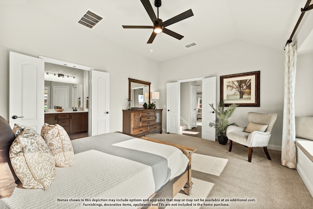 bedroom with connected bathroom, light carpet, ceiling fan, and vaulted ceiling